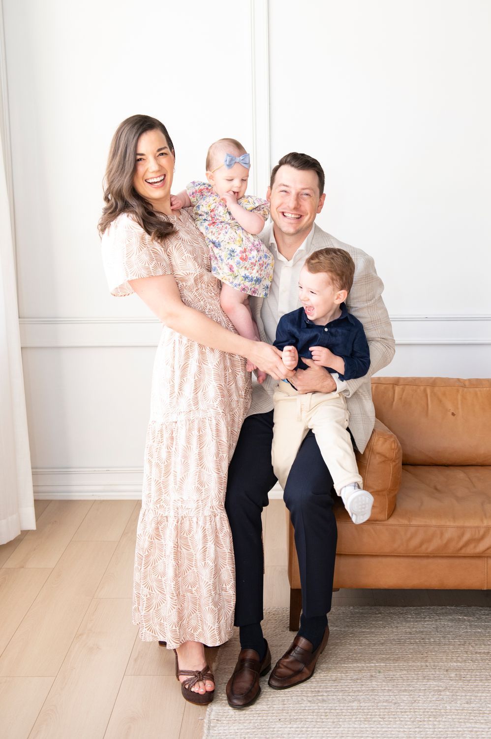 Happy family portrait with two young children.