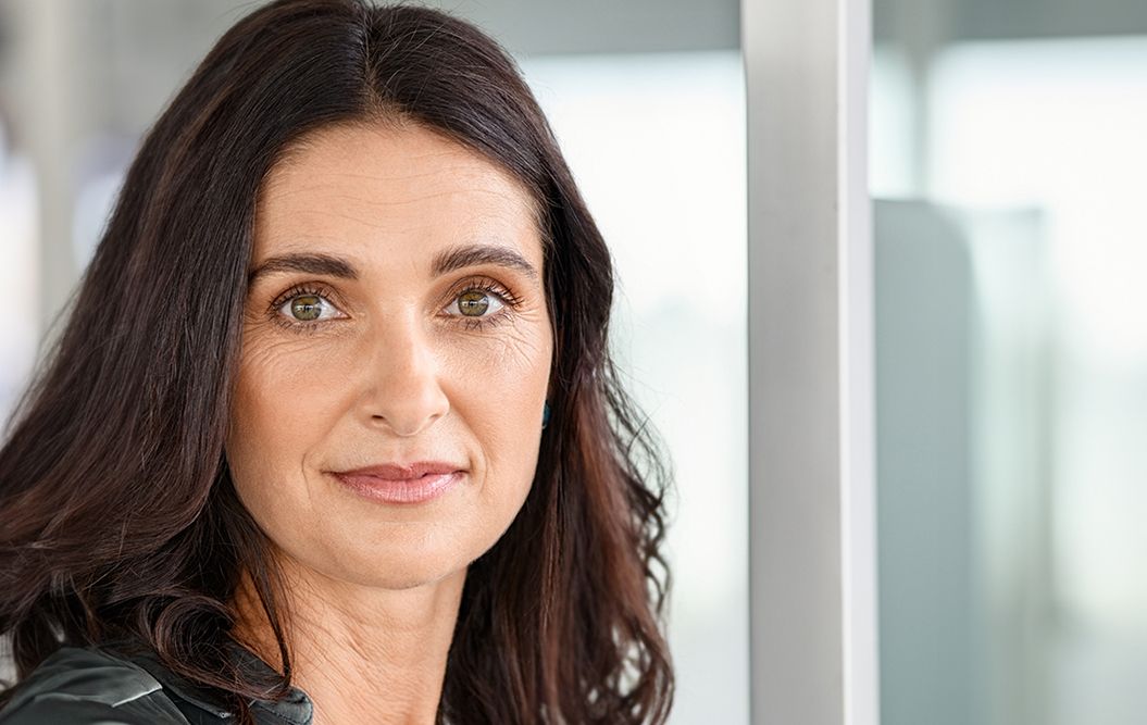 Portrait of a woman with long, dark hair.