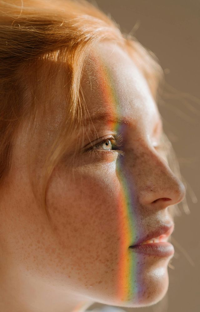 Close-up of a woman with curly hairstyle.
