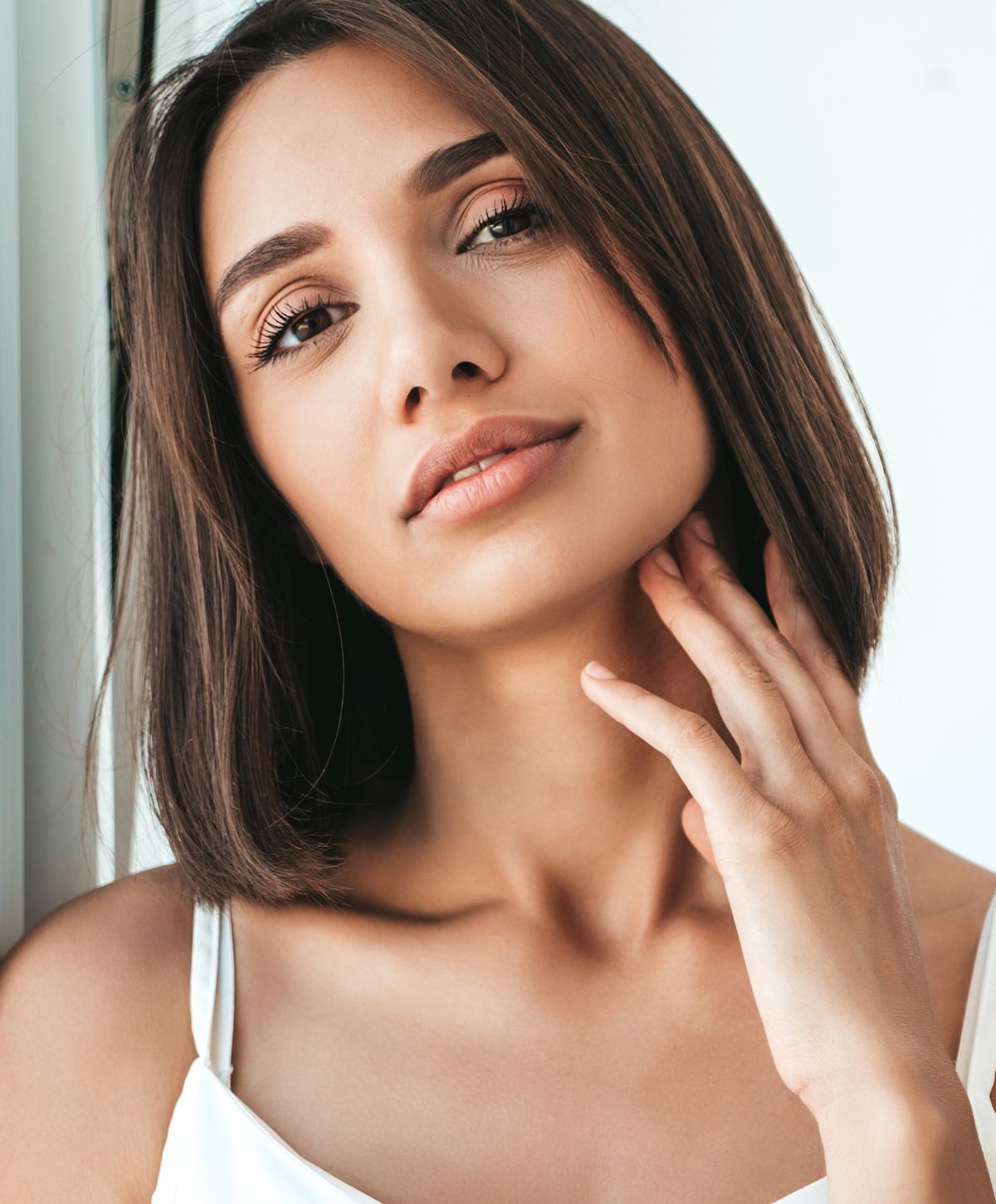 Portrait of a woman with a thoughtful expression.