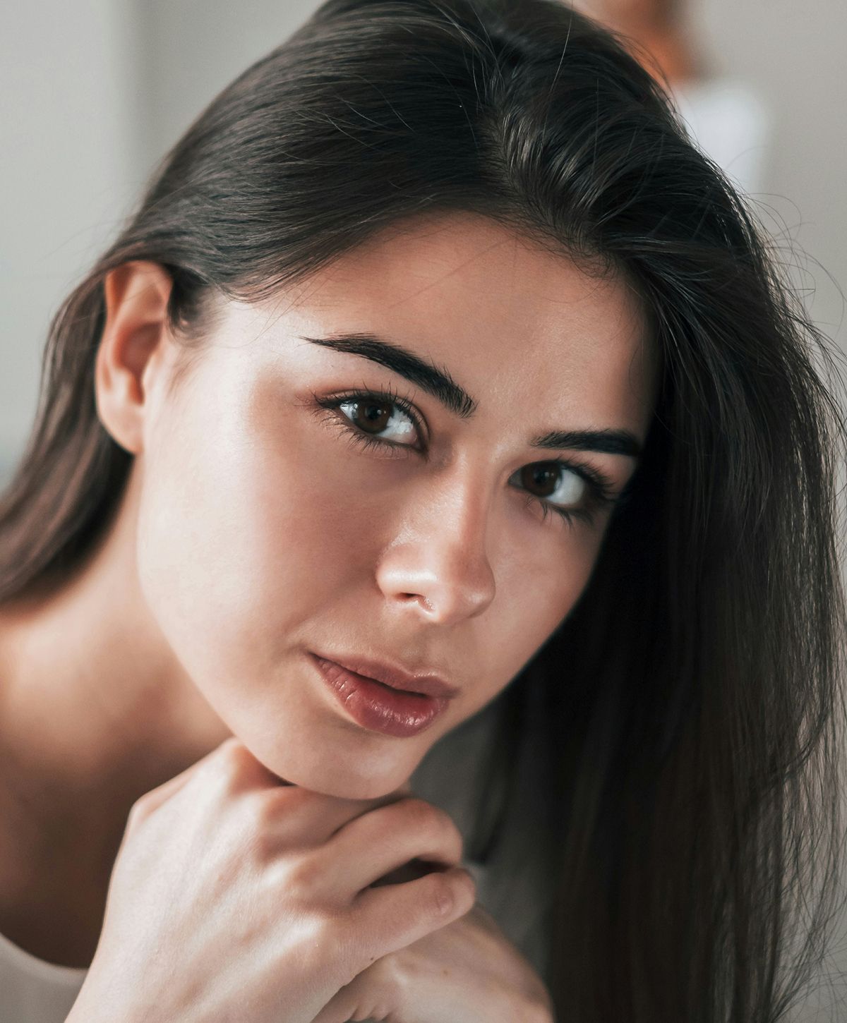 Close-up of a young woman with flowing hair.